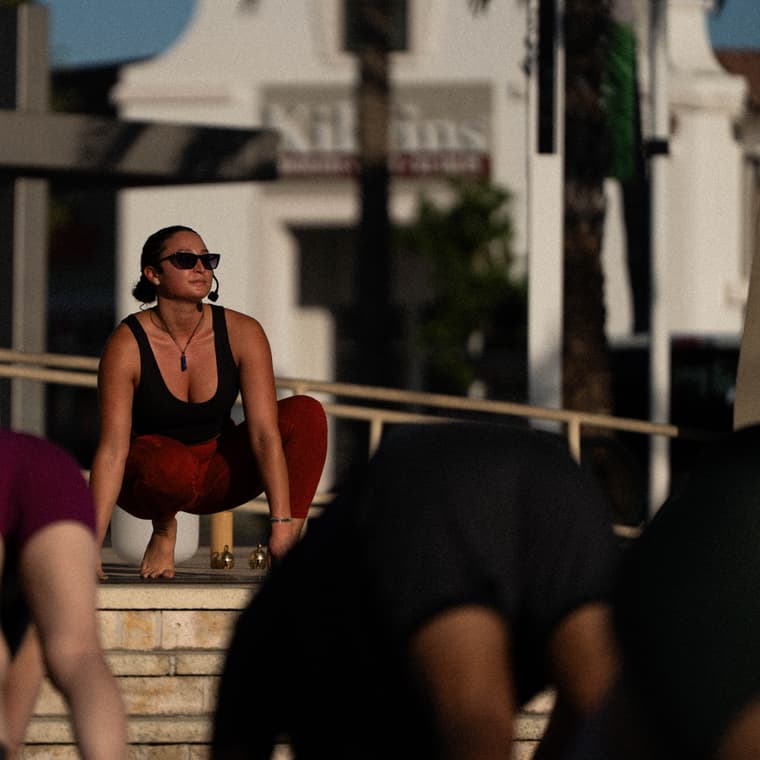 Jessica guiding an outdoor yoga class